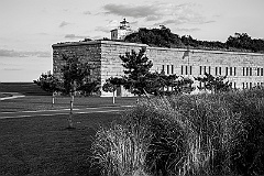 Clarks Point Light Sits Atop of Stone Wall of Fort Taber -BW